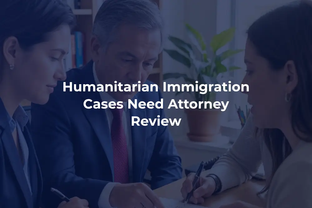 Attorney reviewing humanitarian immigration case documents with a client.